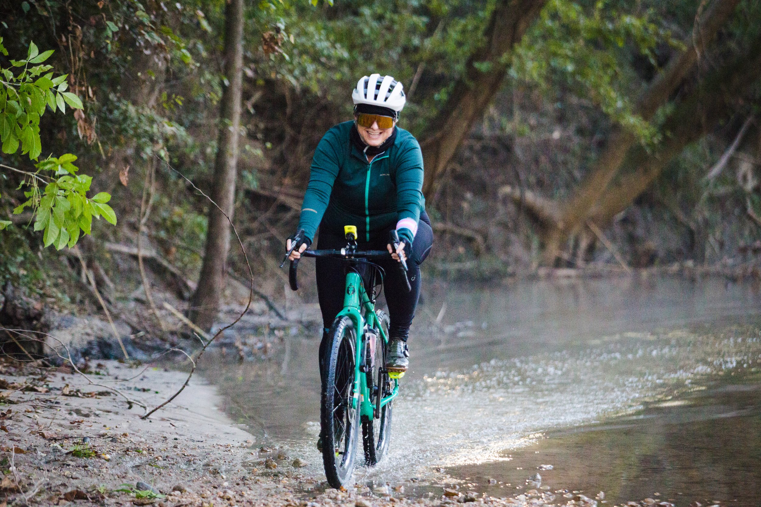 Devin smiles through the gravel route water crossing.  Photo by:  Venny Alub